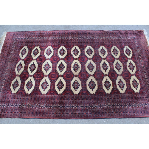20 - Pakistan rug of Turkoman design with three rows of nine gols, 208cms x 125cms