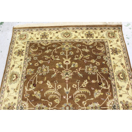 26 - Small Indo Persian rug with an all-over stylised floral design in shades of beige and cream, 181cms ... 