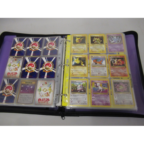 355 - Folder containing a large quantity of Japanese and American Pokemon cards including Base, Jungle, Fo... 