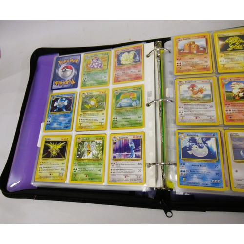 355 - Folder containing a large quantity of Japanese and American Pokemon cards including Base, Jungle, Fo... 