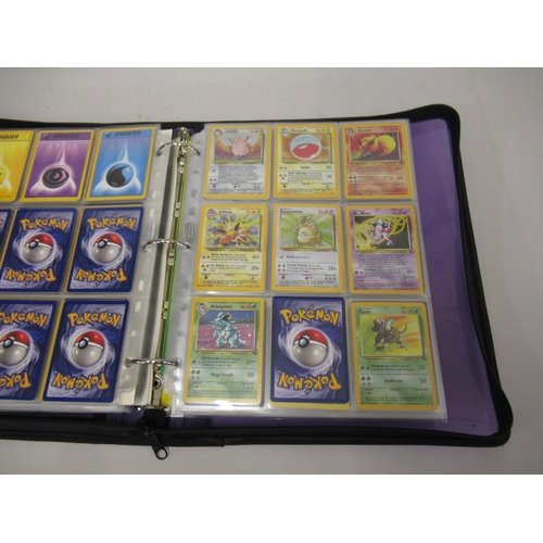 355 - Folder containing a large quantity of Japanese and American Pokemon cards including Base, Jungle, Fo... 