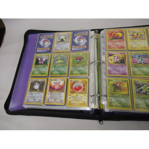 355 - Folder containing a large quantity of Japanese and American Pokemon cards including Base, Jungle, Fo... 