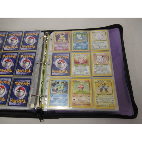 355 - Folder containing a large quantity of Japanese and American Pokemon cards including Base, Jungle, Fo... 