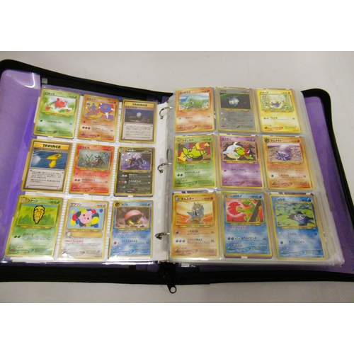 355 - Folder containing a large quantity of Japanese and American Pokemon cards including Base, Jungle, Fo... 