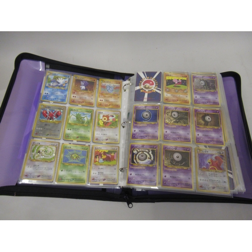 355 - Folder containing a large quantity of Japanese and American Pokemon cards including Base, Jungle, Fo... 