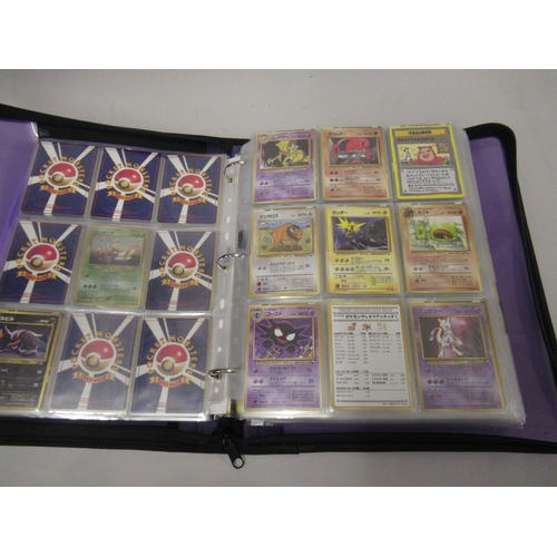 355 - Folder containing a large quantity of Japanese and American Pokemon cards including Base, Jungle, Fo... 