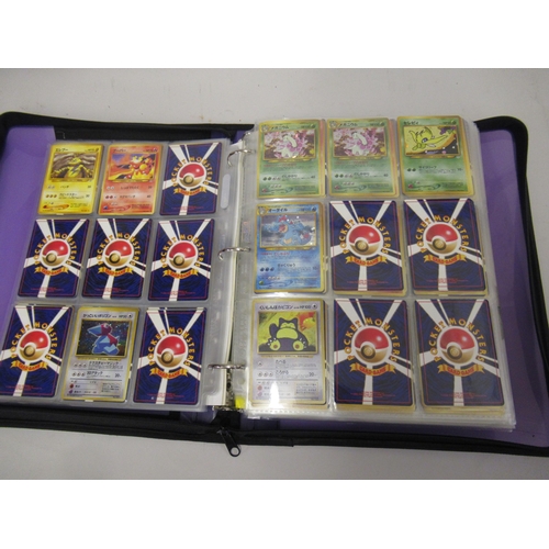 355 - Folder containing a large quantity of Japanese and American Pokemon cards including Base, Jungle, Fo... 