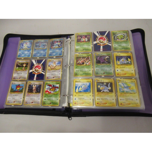 355 - Folder containing a large quantity of Japanese and American Pokemon cards including Base, Jungle, Fo... 