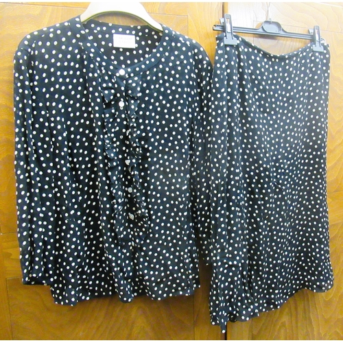 37 - Caroline Charles, London, black and white polka dot blouse and matching skirt, with original packagi... 