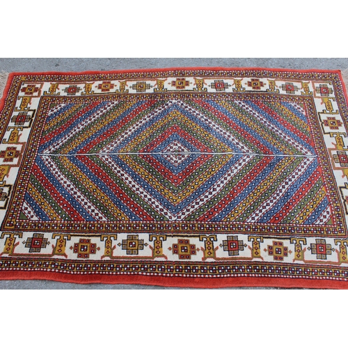 4 - 20th Century Turkish rug of Caucasian design with a polychrome geometric centre panel and borders, 1... 