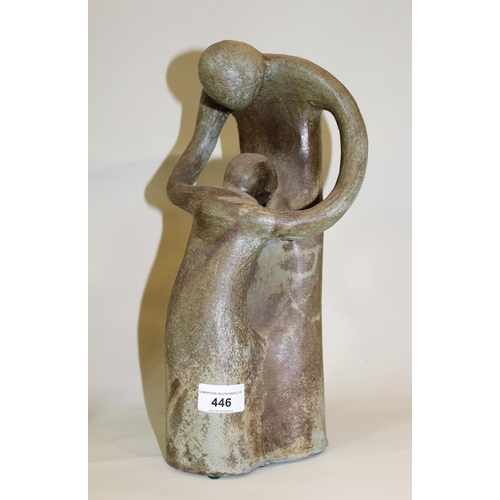 446 - 20th Century stoneware group of a mother and child, unsigned, 34cms high