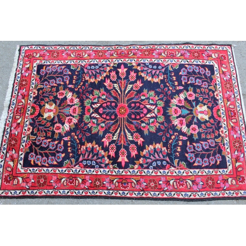 5 - 20th Century Sarouk rug with a typical floral design on a midnight blue ground with borders, 152cms ... 