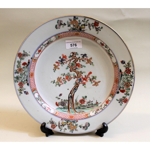 576 - 18th Century Chinese circular wall plate painted with a flowering tree, 28cms diameter (at fault)