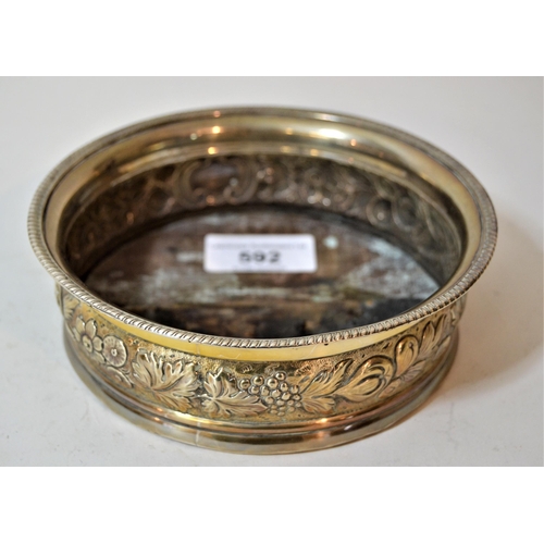 592 - George III silver wine bottle coaster, with floral embossed decoration, marks obscured