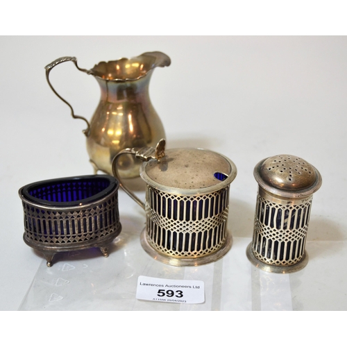 593 - Chester silver three piece condiment set, with blue glass liners, together with a small silver cream... 