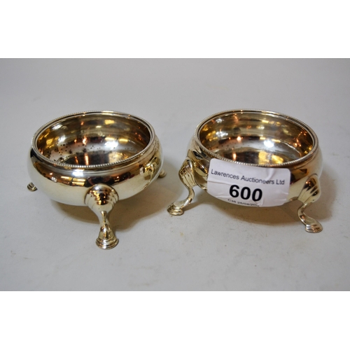 600 - Pair of George III London silver circular salts on cabriole hoof supports (marks rubbed)