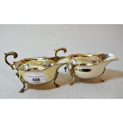 608 - Pair of silver helmet shaped sauce boats, 9.5 oz t