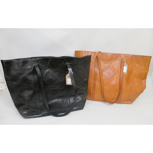 65 - Jaeger, two large leather tote bags, together with a brown leather holdall and a canvas holdall with... 