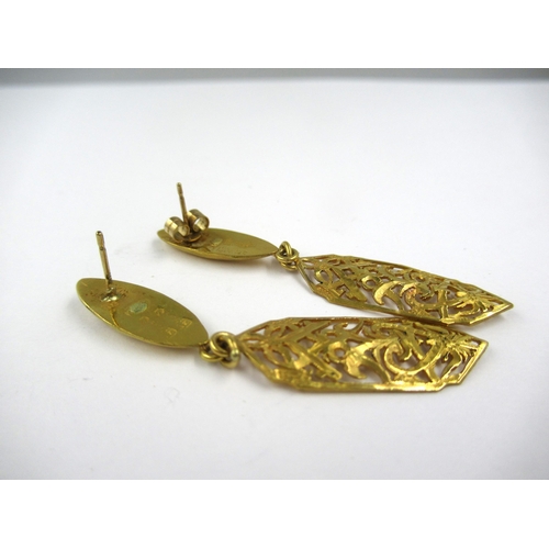 701 - Pair of yellow metal drop earrings of pierced design