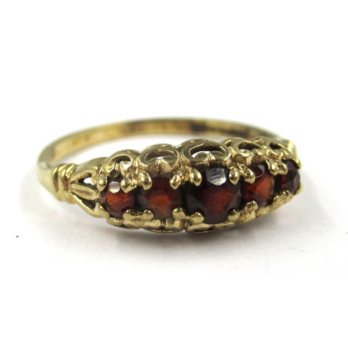 725 - 9ct Yellow gold five stone garnet set ring, size K