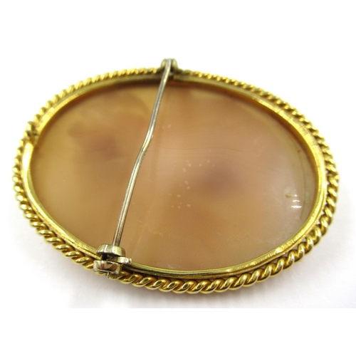 727 - 9ct Yellow gold mounted oval carved shell cameo brooch