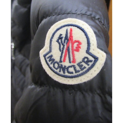 77 - Moncler, ladies navy blue goose down jacket, size 0, with authenticity tag still attached, together ... 