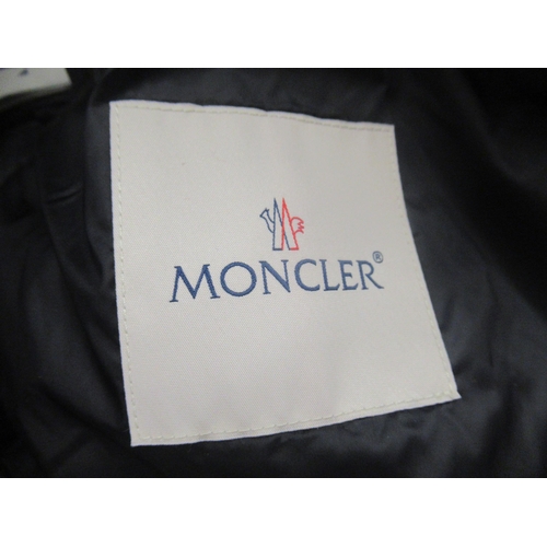 77 - Moncler, ladies navy blue goose down jacket, size 0, with authenticity tag still attached, together ... 