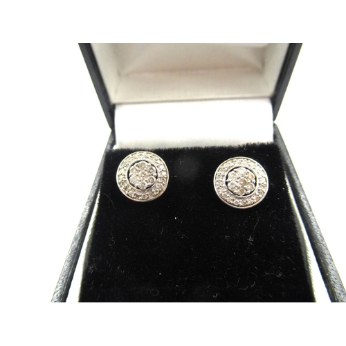 818 - Pair of circular silver diamond cluster stud earrings