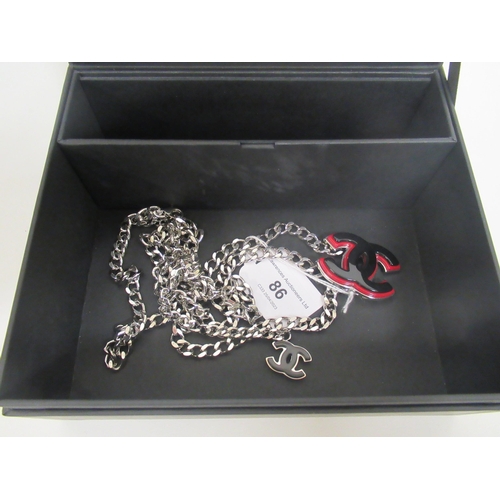 86 - Chanel, 2005, chain link belt with red and black enamel logos, in a Chanel box