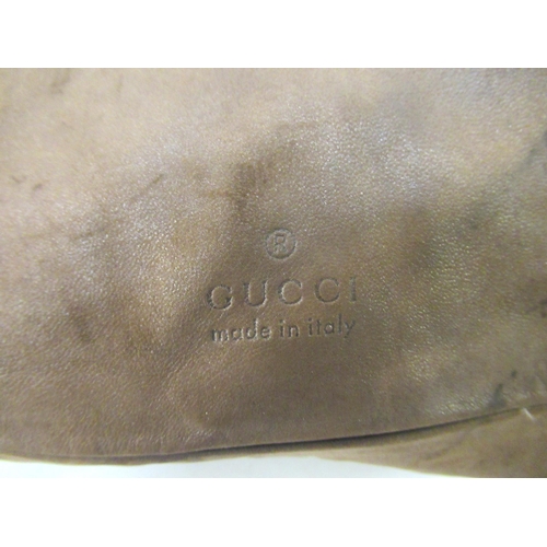 99 - Gucci, brown leather cushion, with original price ticket