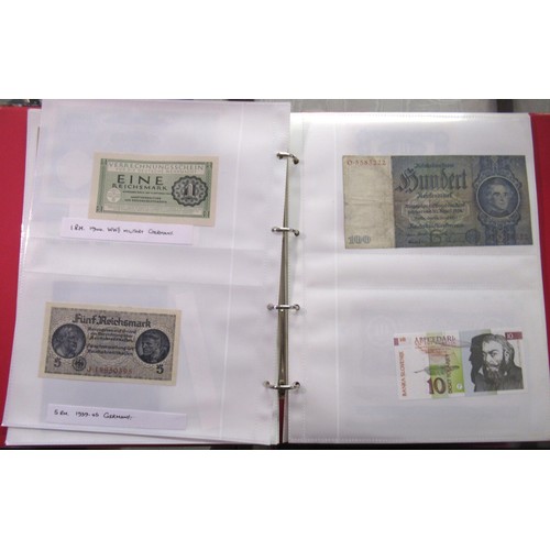 807 - Two folders containing a quantity of World bank notes