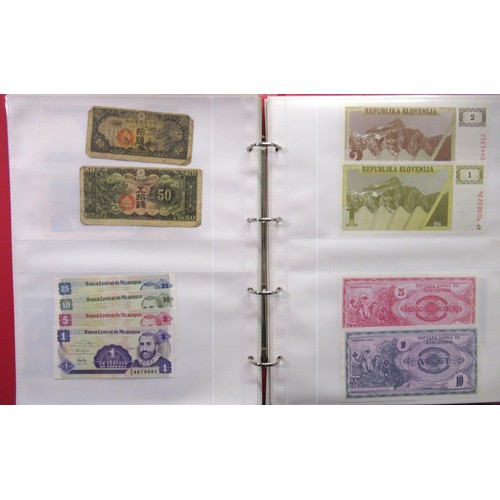 807 - Two folders containing a quantity of World bank notes