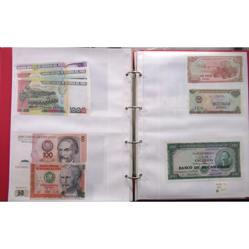 807 - Two folders containing a quantity of World bank notes