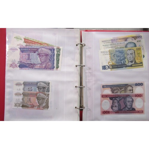 807 - Two folders containing a quantity of World bank notes