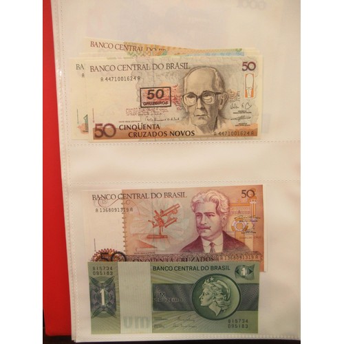 807 - Two folders containing a quantity of World bank notes