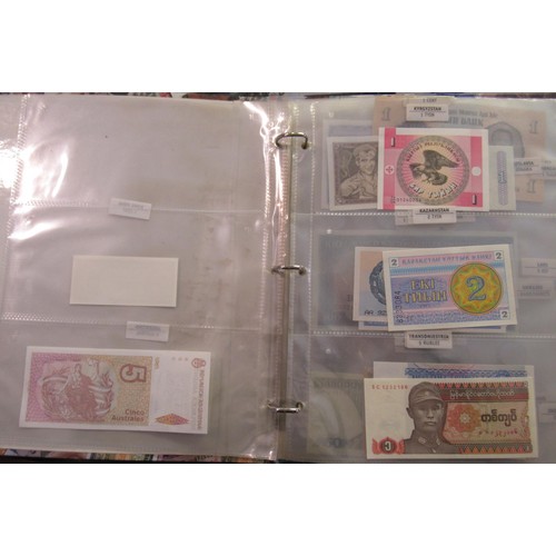 807 - Two folders containing a quantity of World bank notes