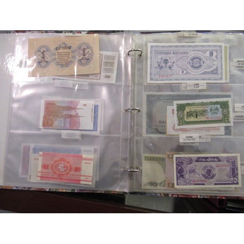 807 - Two folders containing a quantity of World bank notes