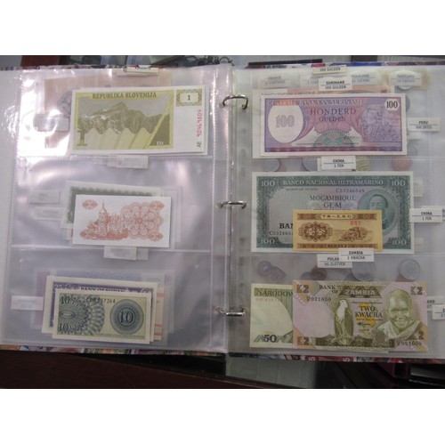 807 - Two folders containing a quantity of World bank notes