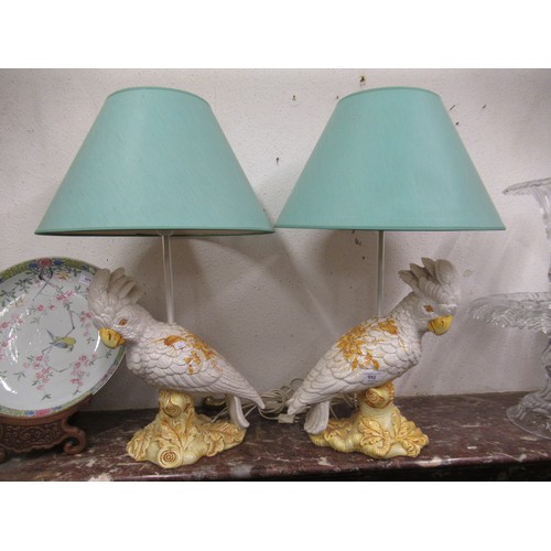 552 - Pair of mid 20th Century Continental pottery table lamps, each in the form of a cockatoo, 39cms high... 