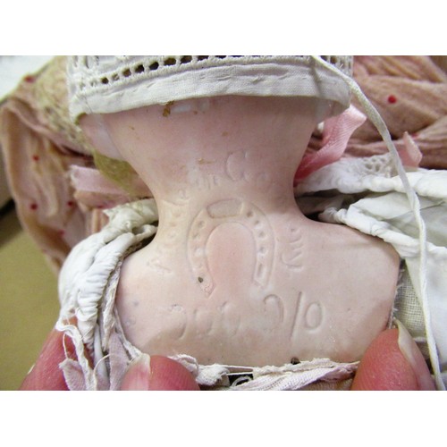 195 - Early 20th Century German bisque headed doll with sleeping eyes, open mouth and four teeth on a join... 