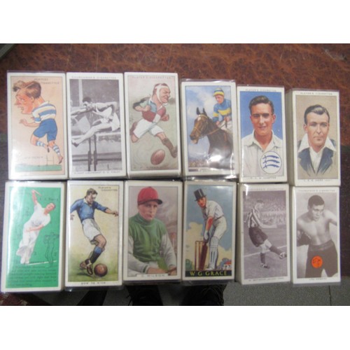 249 - Two grey trays containing 120 sets of cigarette cards