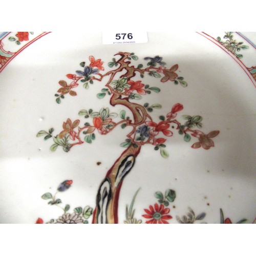 576 - 18th Century Chinese circular wall plate painted with a flowering tree, 28cms diameter (at fault)