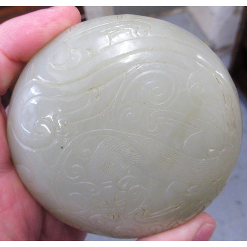 152 - Small 20th Century carved pale green jade circular box and cover, decorated in shallow relief, 8.5cm... 