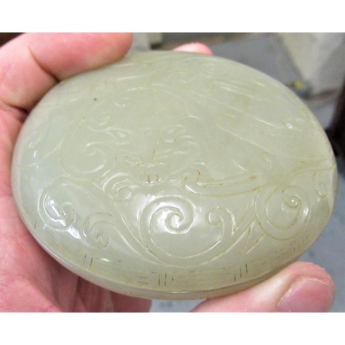 152 - Small 20th Century carved pale green jade circular box and cover, decorated in shallow relief, 8.5cm... 