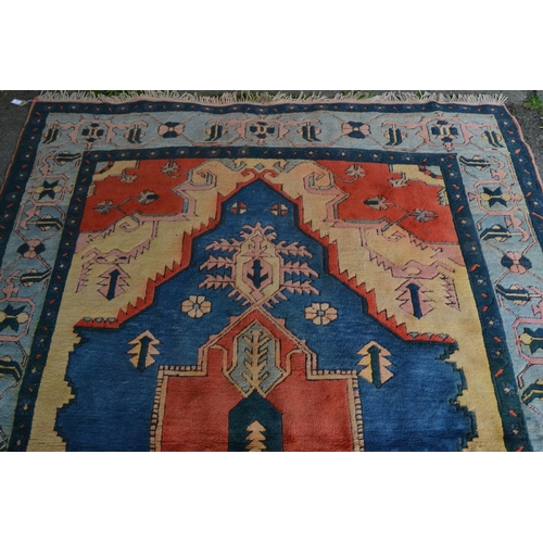 13 - Turkish carpet with a large lobed medallion design in shades of terracotta and blue and beige, 270cm... 