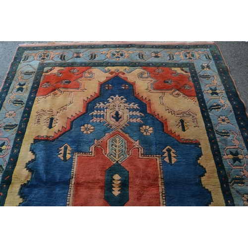 13 - Turkish carpet with a large lobed medallion design in shades of terracotta and blue and beige, 270cm... 