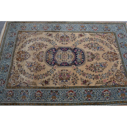 14 - Tabriz rug with a medallion and all-over floral design on a beige ground with borders, 210cmms x 144... 