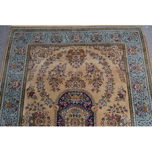14 - Tabriz rug with a medallion and all-over floral design on a beige ground with borders, 210cmms x 144... 