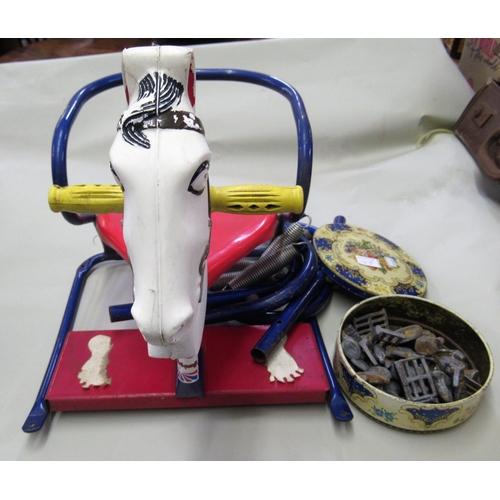 169 - Triang children's rocking horse with original label (disassembled), and a tin containing a collectio... 