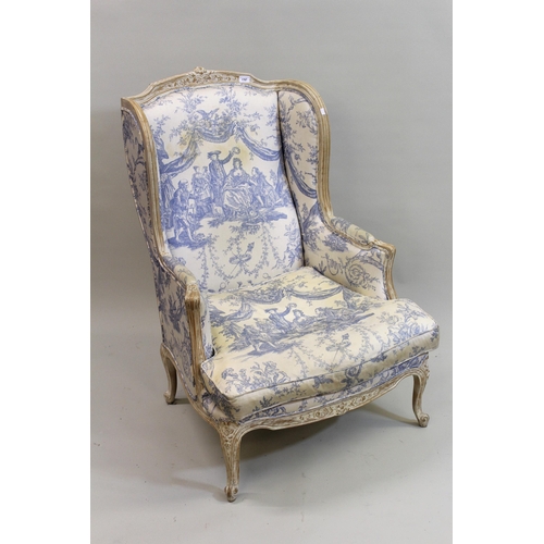 1787 - 20th Century French beech, lime waxed wing back armchair, with blue and white upholstery, loose cush... 